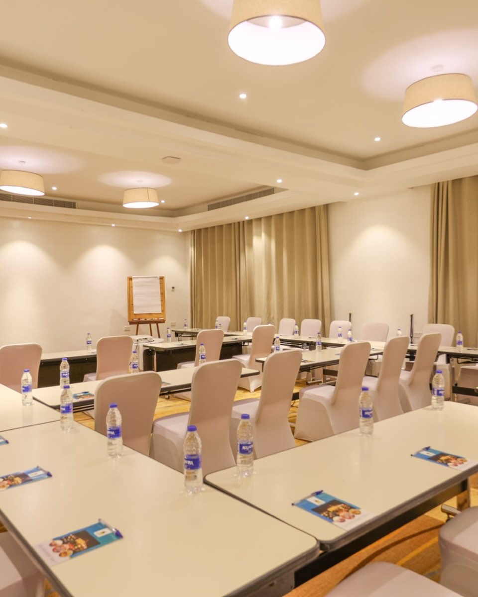 Meeting room set with flip chart and water
