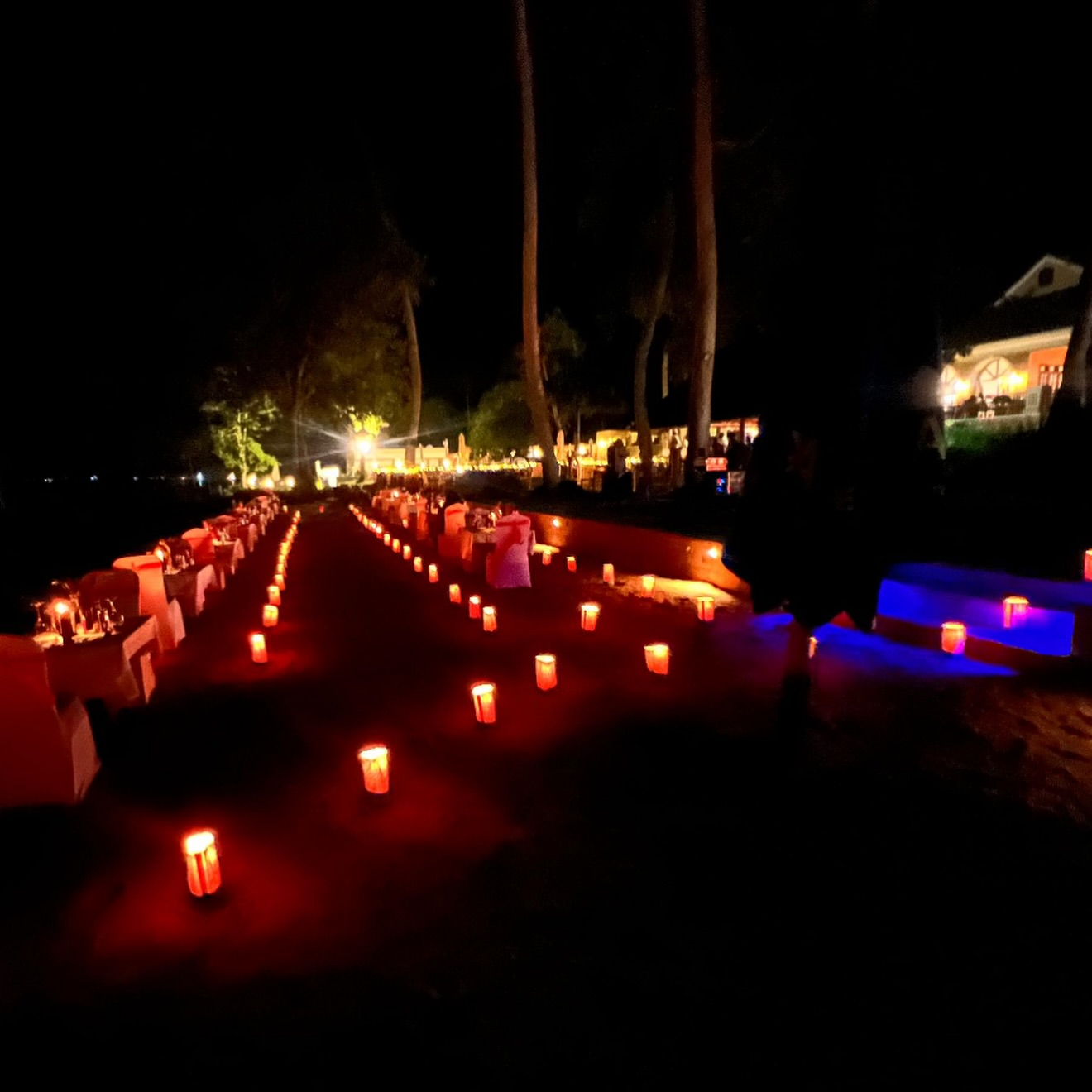 Candlelit dinner setup on the beach